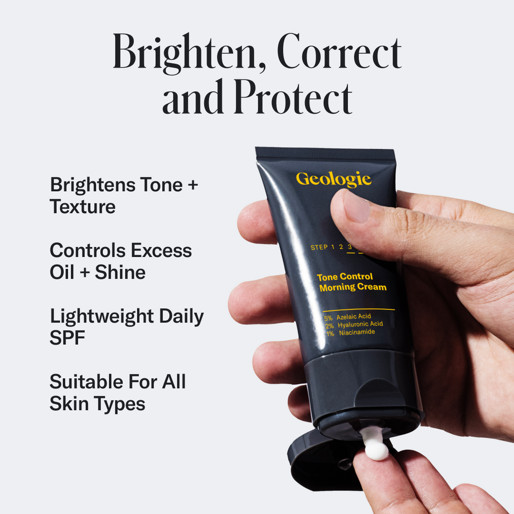 A hand squeezing Geologie's Tone Control Face Cream with SPF15 from a tube labeled 'Geologie' with text promoting its benefits: 'brighten, correct, protect, and soothe with sensitive skin moisturizer.