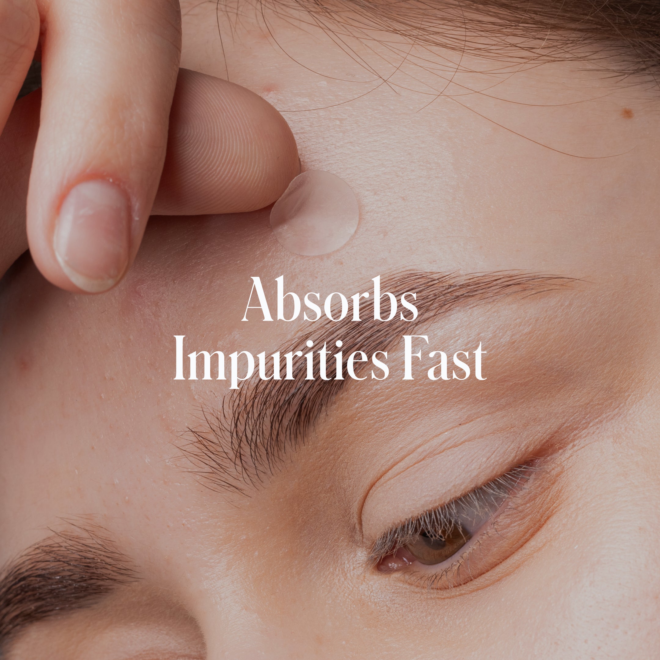 A close-up of a person applying the Geologie Anti Pimple Pack to their forehead, with the text 