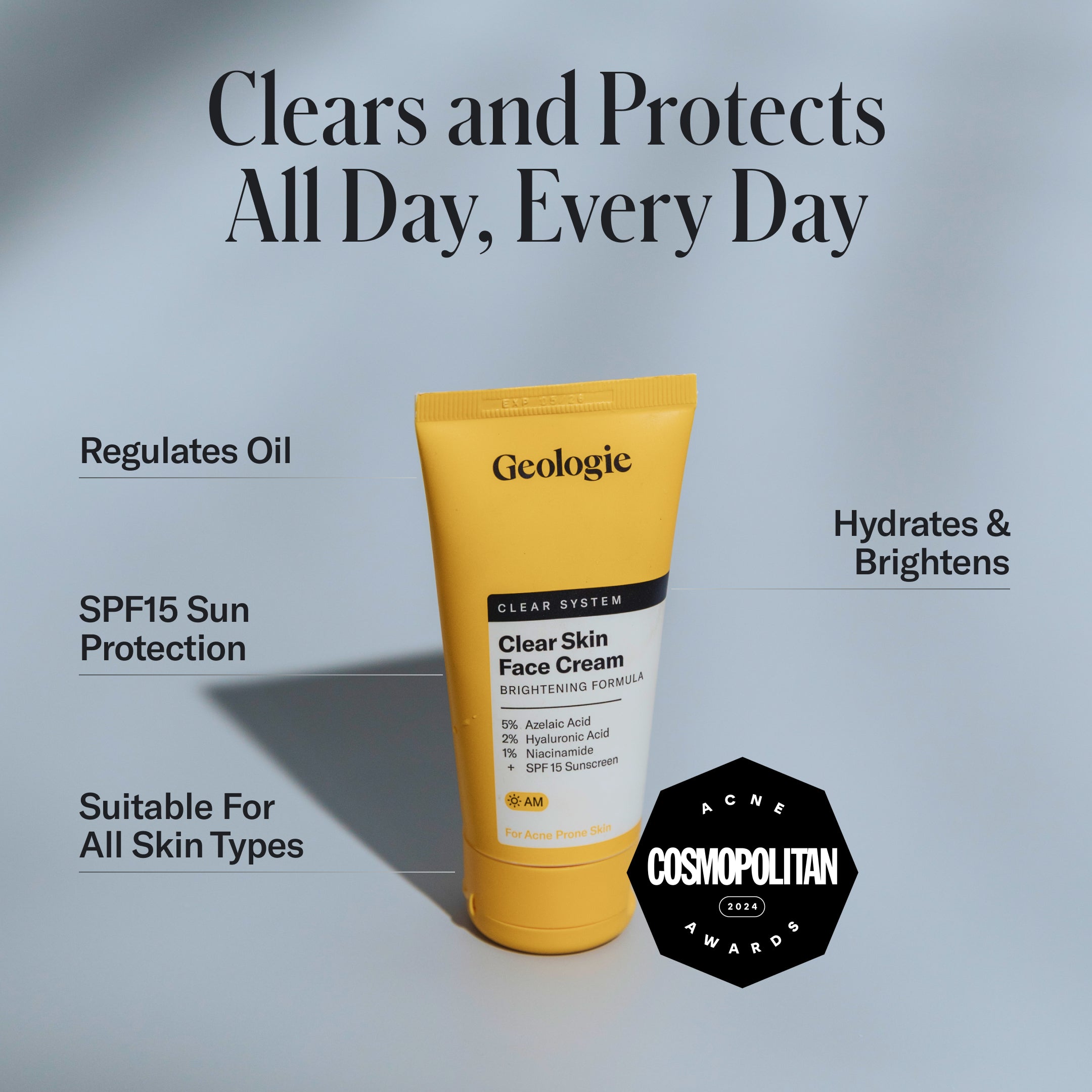A tube of Geologie Clear Skin Face Cream stands upright on a blue surface, surrounded by text highlighting benefits like SPF15, oil regulation, hydration, and brightening.
