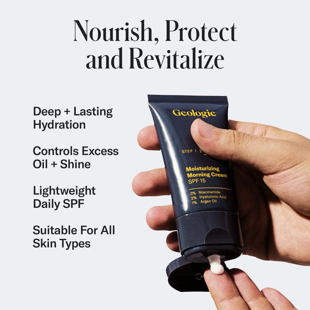 Hand squeezing a tube of Geologie's Complete Skincare Set against a black background, highlighting skincare product features like hydration and oil control with clinically-proven ingredients.