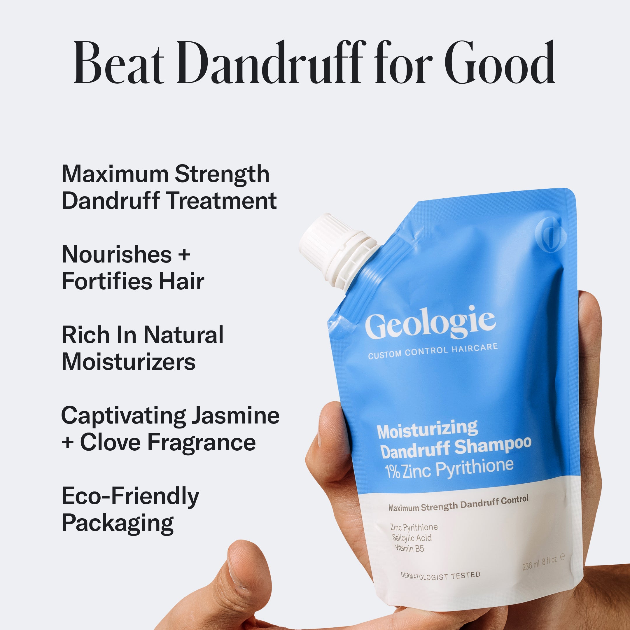 A hand holding a blue pouch of Geologie's Moisturizing Dandruff Shampoo with text listing benefits: maximum strength dandruff treatment, nourishes hair, natural moisturizers for dry scalps, jasmine/clove fragrance, and eco-friendly packaging for flake-free locks.