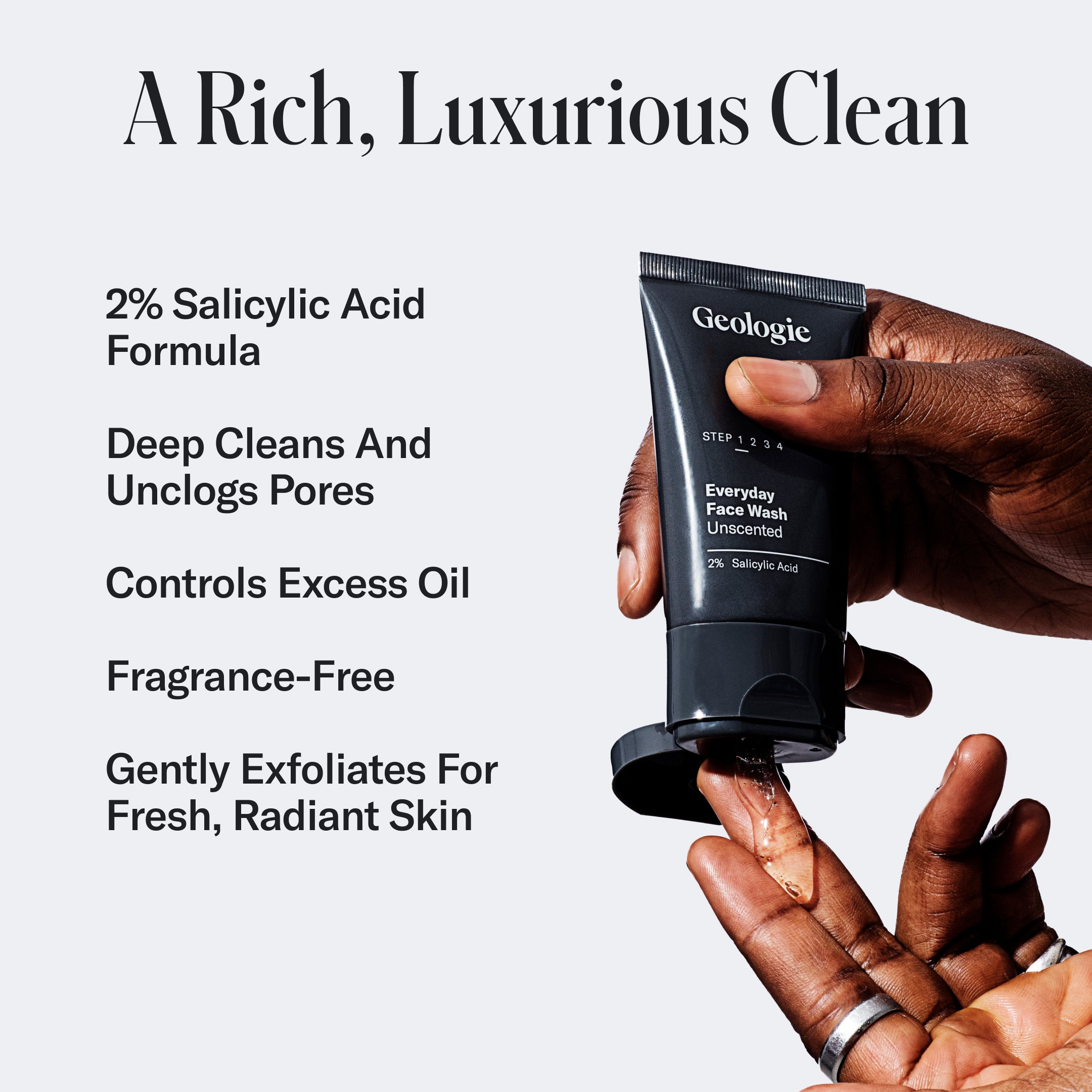 A hand holding a tube of Geologie Ultimate Skincare Set for breakouts, labeled for everyday use, positioned over another hand against a text background describing the product's benefits.