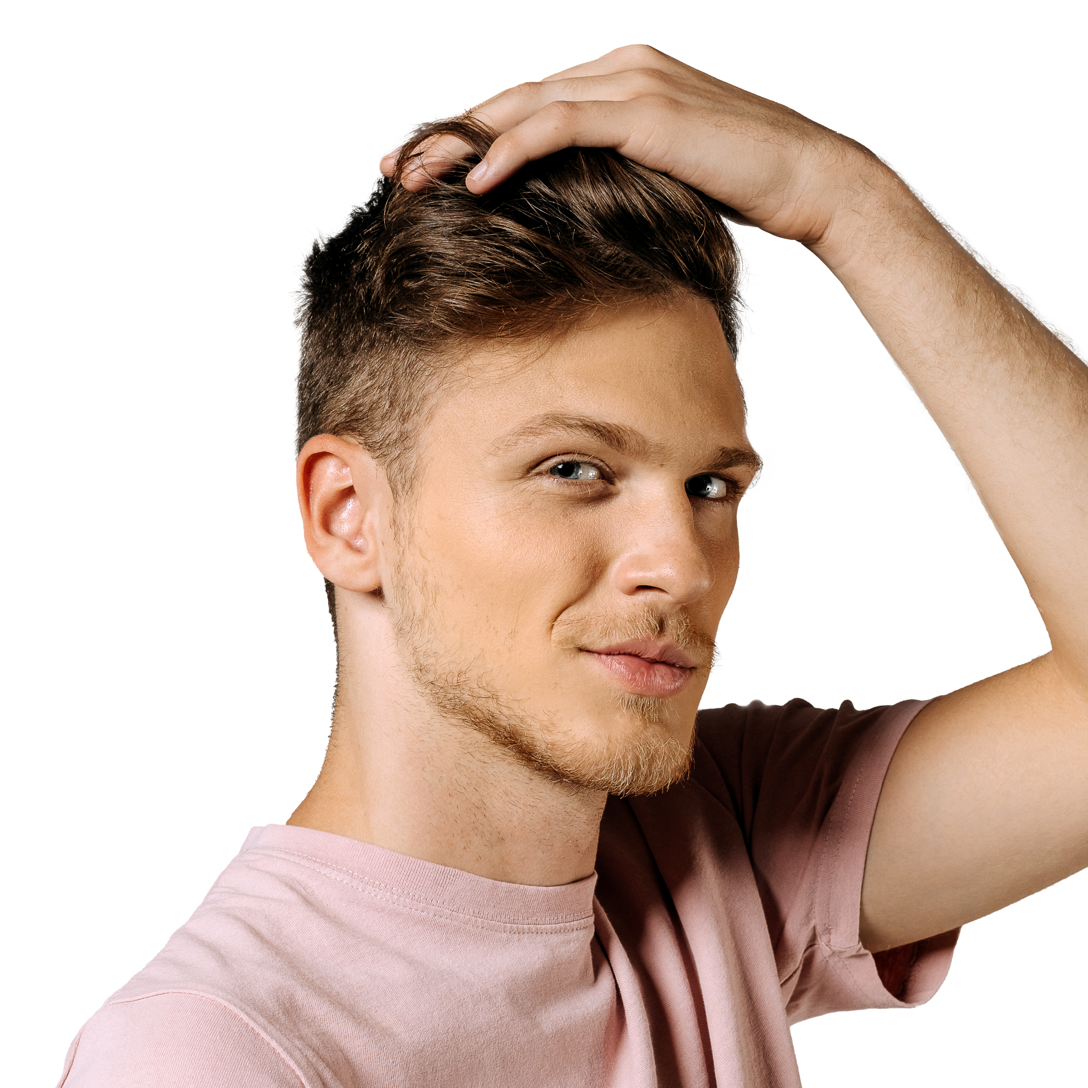 A young man with styled hair from Geologie's Custom Control Hair Routine innovations smiling and looking to the side, his hand resting on his head.