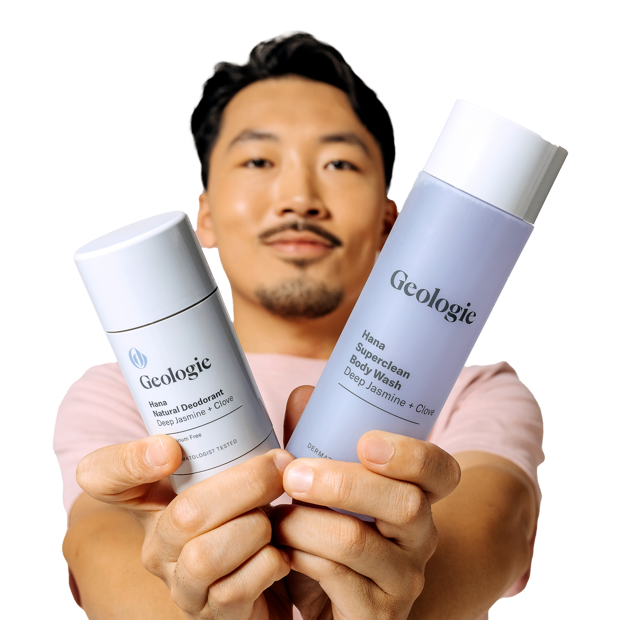 A man presenting Geologie's Body Bundle, featuring a luxurious body wash and a long-lasting deodorant, to the camera.