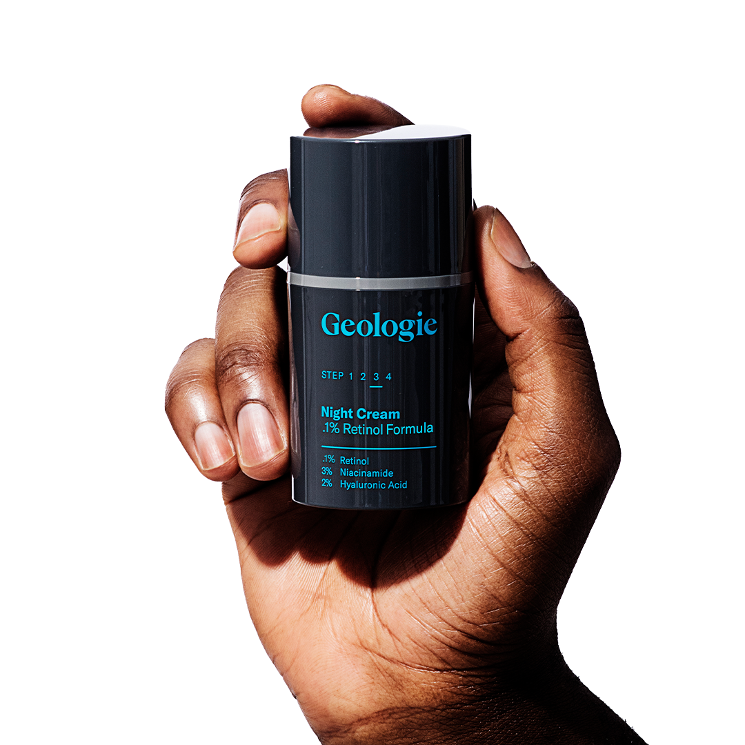 A hand holding a container of Geologie Anti Aging Duo with a 0.3% retinol formula.