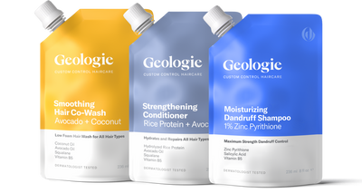 Three bottles of Geologie Smoothing Co-Wash, Dandruff Shampoo, and Strengthening Conditioner with varying ingredients and benefits displayed side by side.