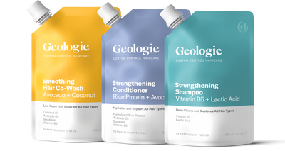 Three bottles of Geologie Complete Hair Routine with Smoothing Co-Wash, strengthening conditioner, and repairing shampoo.